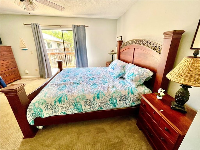 622 Brockinton Pt, Saint Simons Island, GA 31522 - carpeted bedroom with access to exterior, a textured ceiling, and ceiling fan