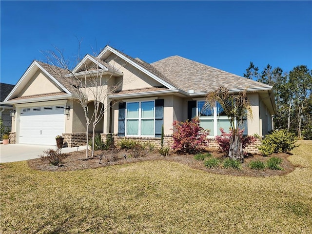 view of front of property featuring a garage, a front lawn, concrete driveway, and stucco siding