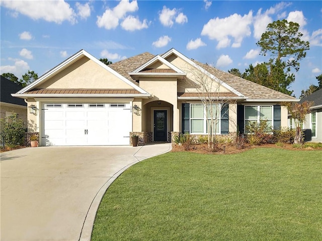 view of front facade featuring a garage and a front yard