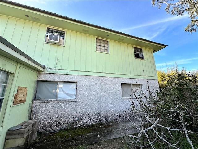 view of side of property featuring cooling unit