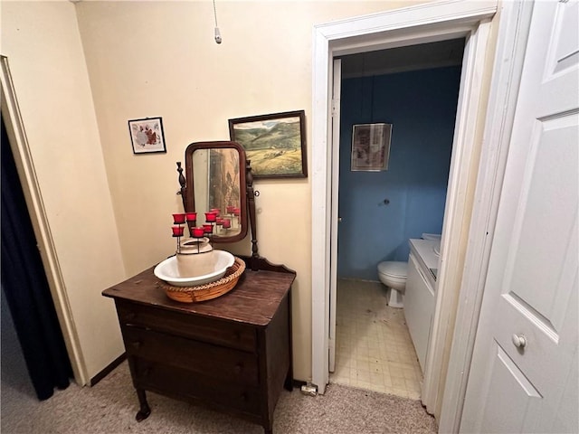 bathroom featuring vanity and toilet