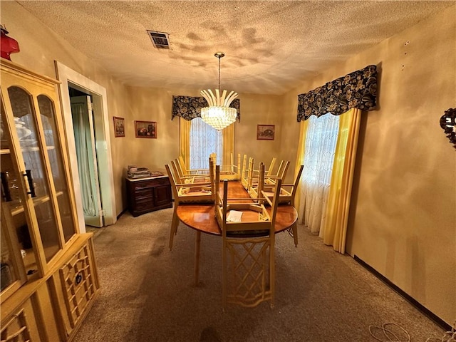 carpeted dining area featuring an inviting chandelier and a textured ceiling