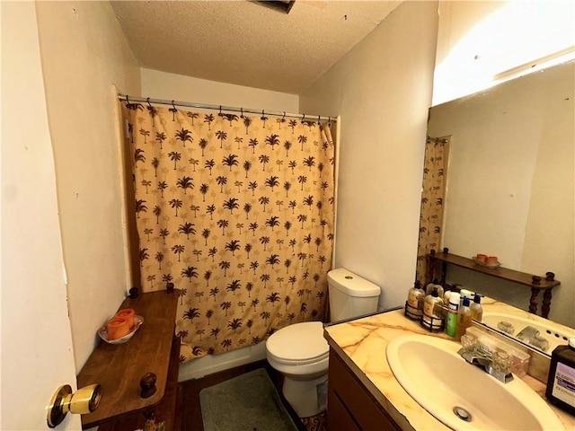 full bathroom featuring vanity, shower / tub combo, a textured ceiling, and toilet