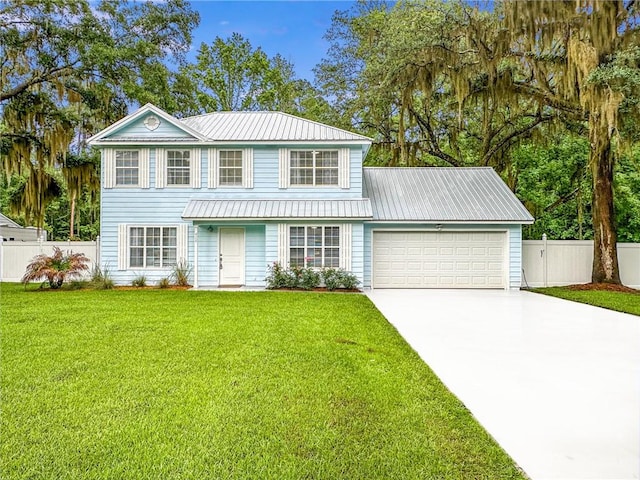 416 S Deals Cir, Woodbine, GA 31569 - traditional-style home with a garage, concrete driveway, and metal roof