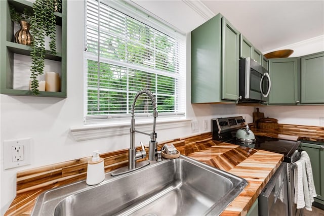 416 S Deals Cir, Woodbine, GA 31569 - kitchen featuring green cabinetry, appliances with stainless steel finishes, butcher block counters, and a sink