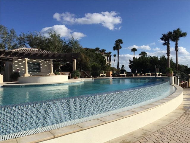 view of swimming pool featuring a pergola