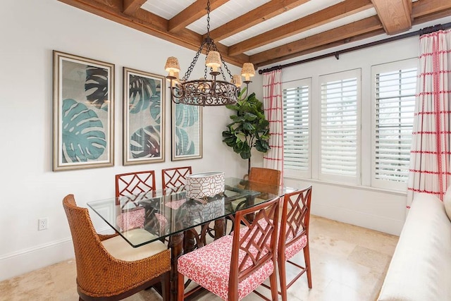 dining area with beam ceiling and an inviting chandelier