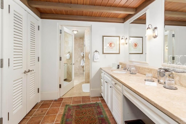 bathroom with tile patterned floors, an enclosed shower, wood ceiling, vanity, and beam ceiling