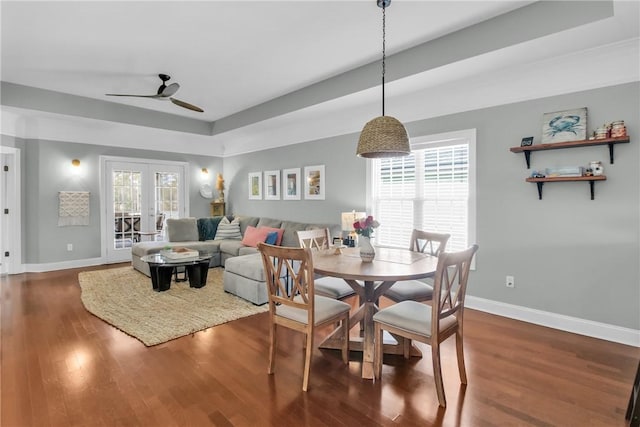 dining area featuring plenty of natural light, dark wood-style flooring, and french doors