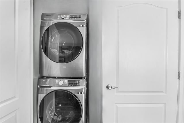 laundry area featuring laundry area and stacked washer and clothes dryer