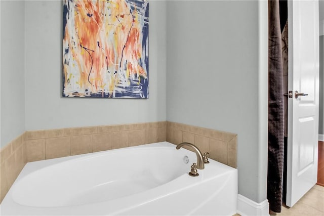 bathroom featuring a bath and tile patterned floors