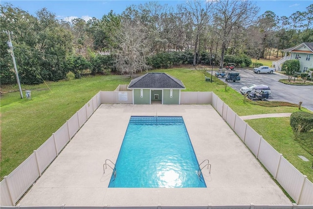 view of pool featuring a fenced in pool, a fenced backyard, an outdoor structure, a patio area, and an exterior structure