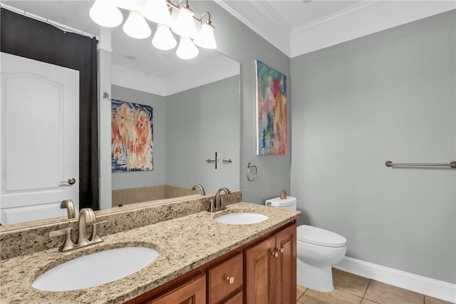 bathroom with crown molding, a sink, toilet, and tile patterned floors