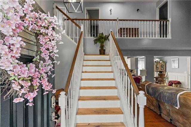 stairs featuring hardwood / wood-style floors