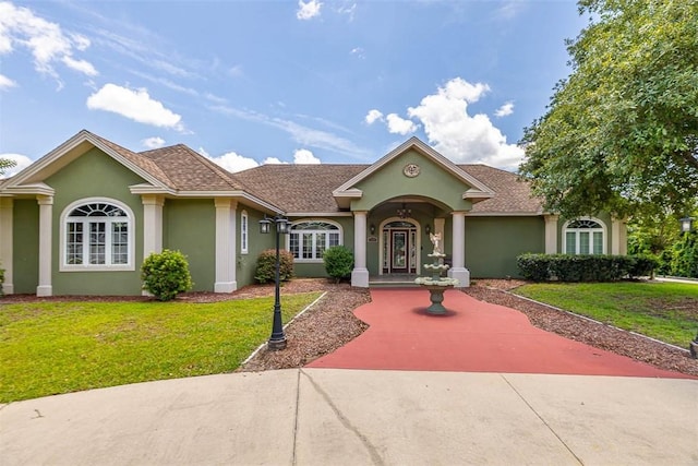 110 Rachel Way, Brunswick, GA 31523 - view of front of house featuring stucco siding and a front yard
