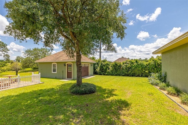 110 Rachel Way, Brunswick, GA 31523 - view of yard with a garage