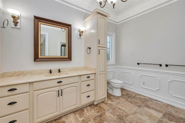110 Rachel Way, Brunswick, GA 31523 - bathroom with vanity, crown molding, stone finish flooring, and wainscoting