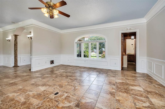 110 Rachel Way, Brunswick, GA 31523 - unfurnished room with ornate columns, ornamental molding, ceiling fan, a decorative wall, and stone tile floors