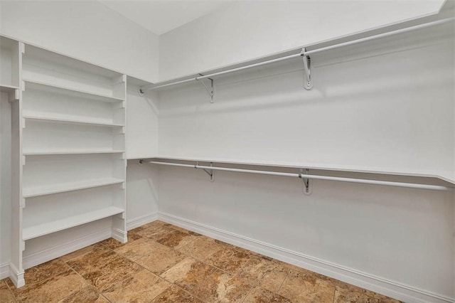 110 Rachel Way, Brunswick, GA 31523 - walk in closet featuring stone finish flooring
