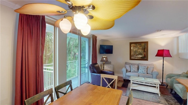 interior space featuring crown molding and a notable chandelier