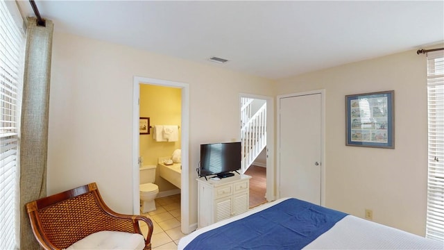 1175 N Beachview Dr Unit 427, Jekyll Island, GA 31527 - tiled bedroom featuring ensuite bath