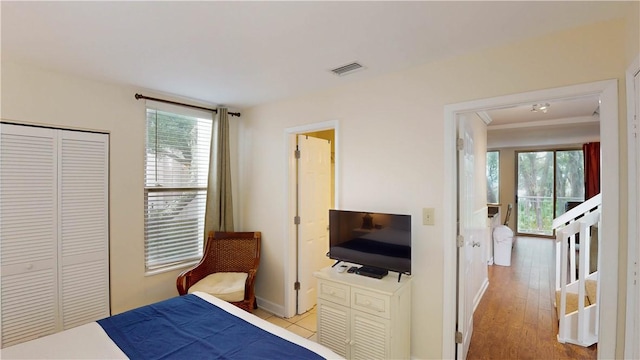 1175 N Beachview Dr Unit 427, Jekyll Island, GA 31527 - bedroom with a closet, baseboards, and wood finished floors
