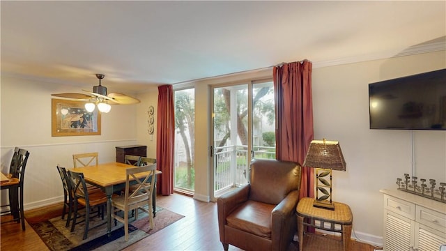 dining room with ceiling fan and hardwood / wood-style flooring