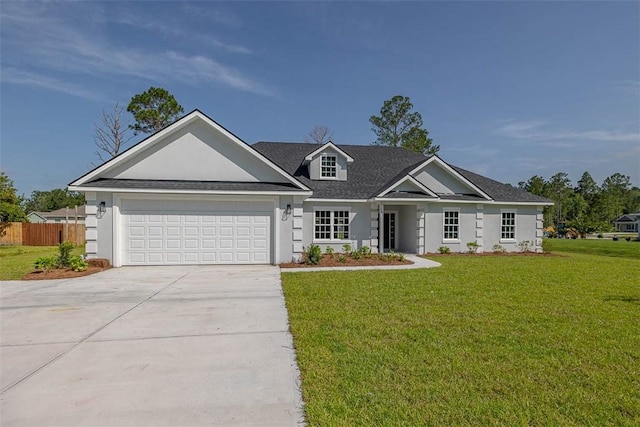 117 Rachel Way, Brunswick, GA 31523 - view of front of house with concrete driveway, an attached garage, stucco siding, and roof with shingles