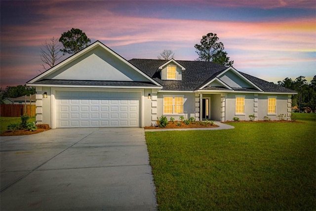 117 Rachel Way, Brunswick, GA 31523 - view of front of house featuring driveway, stucco siding, a garage, and roof with shingles