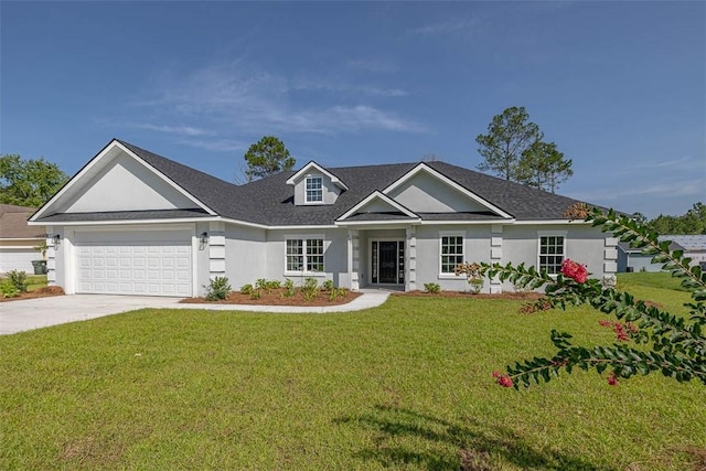 117 Rachel Way, Brunswick, GA 31523 - view of front facade featuring driveway, a front lawn, an attached garage, stucco siding, and roof with shingles