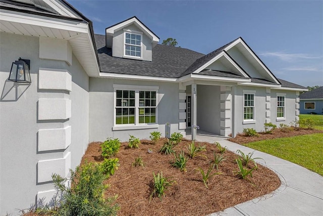 117 Rachel Way, Brunswick, GA 31523 - view of front of property featuring a shingled roof and stucco siding