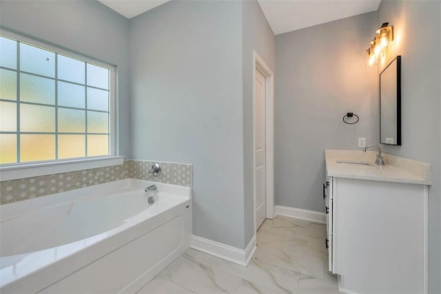 117 Rachel Way, Brunswick, GA 31523 - full bathroom with marble look tiles, vanity, a bath, and plenty of natural light