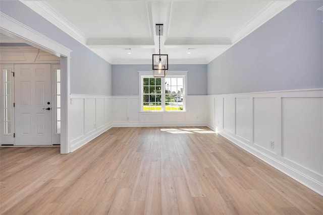 117 Rachel Way, Brunswick, GA 31523 - unfurnished dining area featuring a decorative wall, light wood-type flooring, wainscoting, ornamental molding, and beamed ceiling