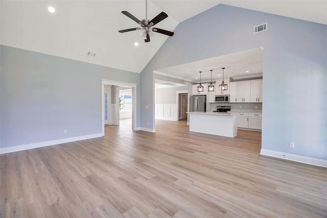 117 Rachel Way, Brunswick, GA 31523 - unfurnished living room with high vaulted ceiling, ceiling fan, light wood-style flooring, and recessed lighting