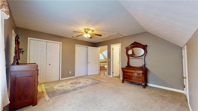 1457 N River Oaks Dr, Blackshear, GA 31516 - unfurnished bedroom featuring two closets, carpet flooring, ceiling fan, and lofted ceiling