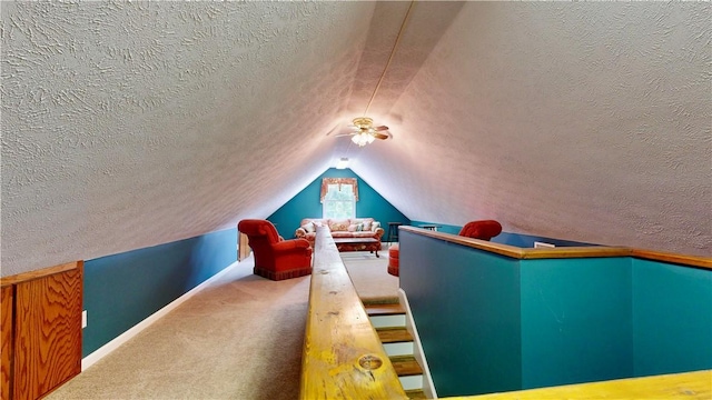 1457 N River Oaks Dr, Blackshear, GA 31516 - carpeted home theater room featuring a textured ceiling, vaulted ceiling, and a ceiling fan