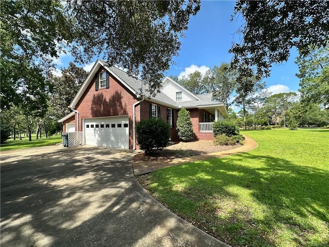 1457 N River Oaks Dr, Blackshear, GA 31516 - view of front of property with brick siding, a front lawn, an attached garage, and driveway