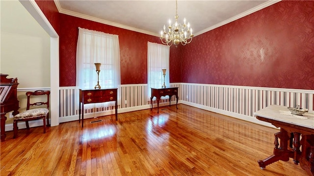 1457 N River Oaks Dr, Blackshear, GA 31516 - spare room featuring hardwood / wood-style floors, a chandelier, and ornamental molding