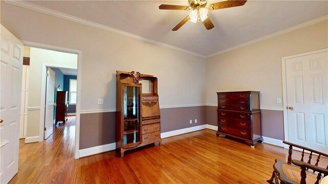 1457 N River Oaks Dr, Blackshear, GA 31516 - bedroom with wood finished floors, crown molding, and ceiling fan