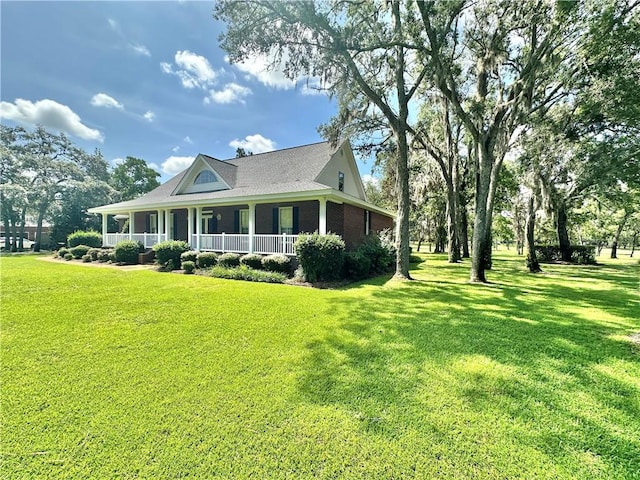 1457 N River Oaks Dr, Blackshear, GA 31516 - view of front of home with a porch and a front yard