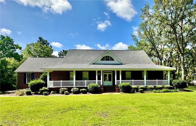 1457 N River Oaks Dr, Blackshear, GA 31516 - farmhouse-style home featuring a porch and a front yard