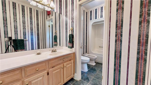 1457 N River Oaks Dr, Blackshear, GA 31516 - full bath with wallpapered walls, vanity, a bidet, bathing tub / shower combination, and tile patterned floors