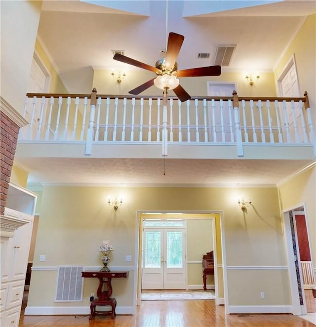 1457 N River Oaks Dr, Blackshear, GA 31516 - foyer entrance with ornamental molding, wood finished floors, a ceiling fan, french doors, and a towering ceiling