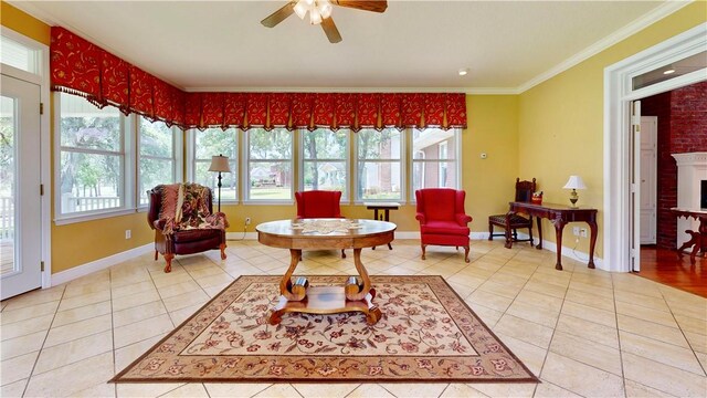 1457 N River Oaks Dr, Blackshear, GA 31516 - sitting room featuring light tile patterned floors, a ceiling fan, ornamental molding, and a brick fireplace