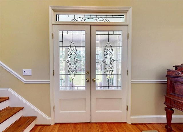 1457 N River Oaks Dr, Blackshear, GA 31516 - foyer entrance featuring french doors, wood finished floors, and stairs