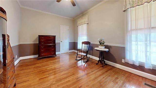 1457 N River Oaks Dr, Blackshear, GA 31516 - living area with wood finished floors, ornamental molding, and a ceiling fan