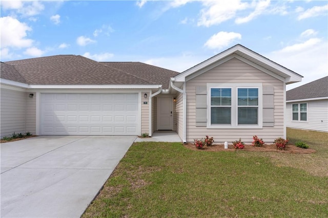 ranch-style home with a front yard and a garage