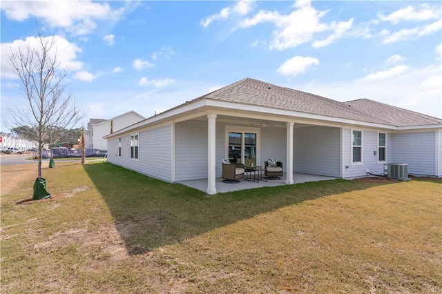 back of house featuring a lawn, a patio area, and an outdoor living space