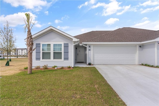 ranch-style house featuring a garage and a front yard