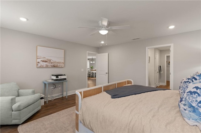 bedroom with ceiling fan and dark wood-type flooring